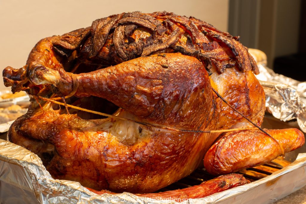 Whole smoked turkey, bacon wrapped